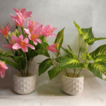 Two artificial flowers with vase